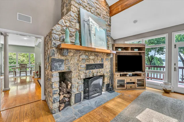 a dining room with furniture a rug and wooden floor