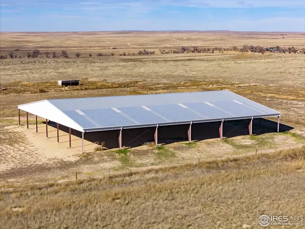a house with pool and ocean view