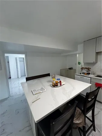 a view of a dining table and chairs