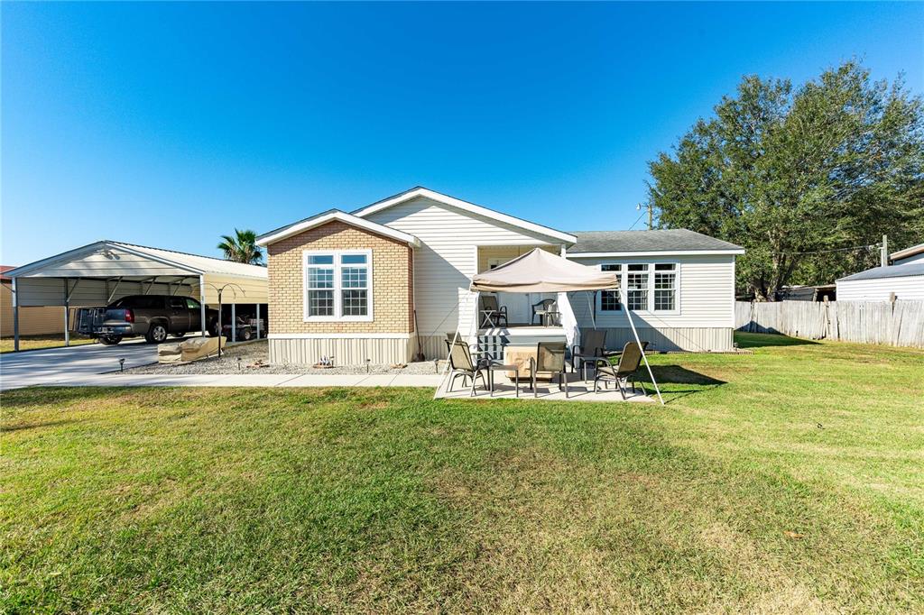10038 Cr 749 Webster Webster, FL 33597 - Photo 1 of 1 a view of a house with sitting area and swimming pool