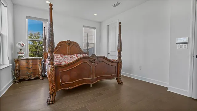 a bedroom with a bed and a table