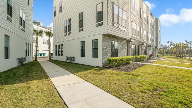 a view of a white building with a outdoor space