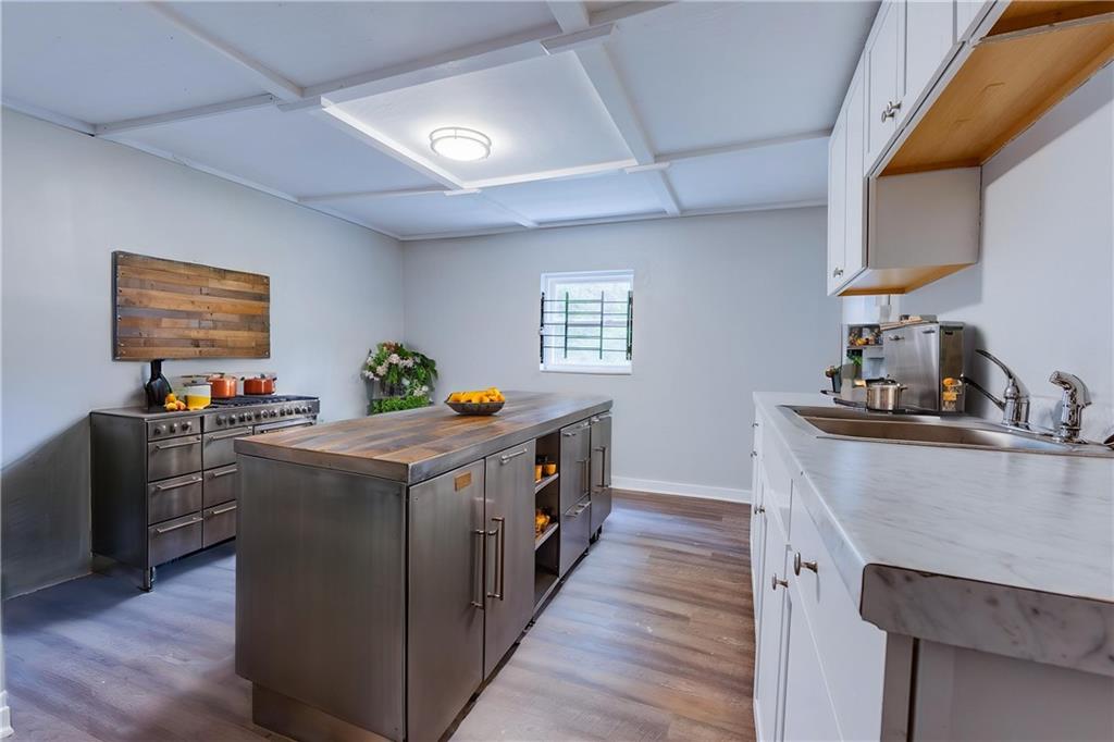 1931 Federal Street Extension Pittsburgh, PA 15212 - Photo 13 of 32 a kitchen with stainless steel appliances a stove and a sink