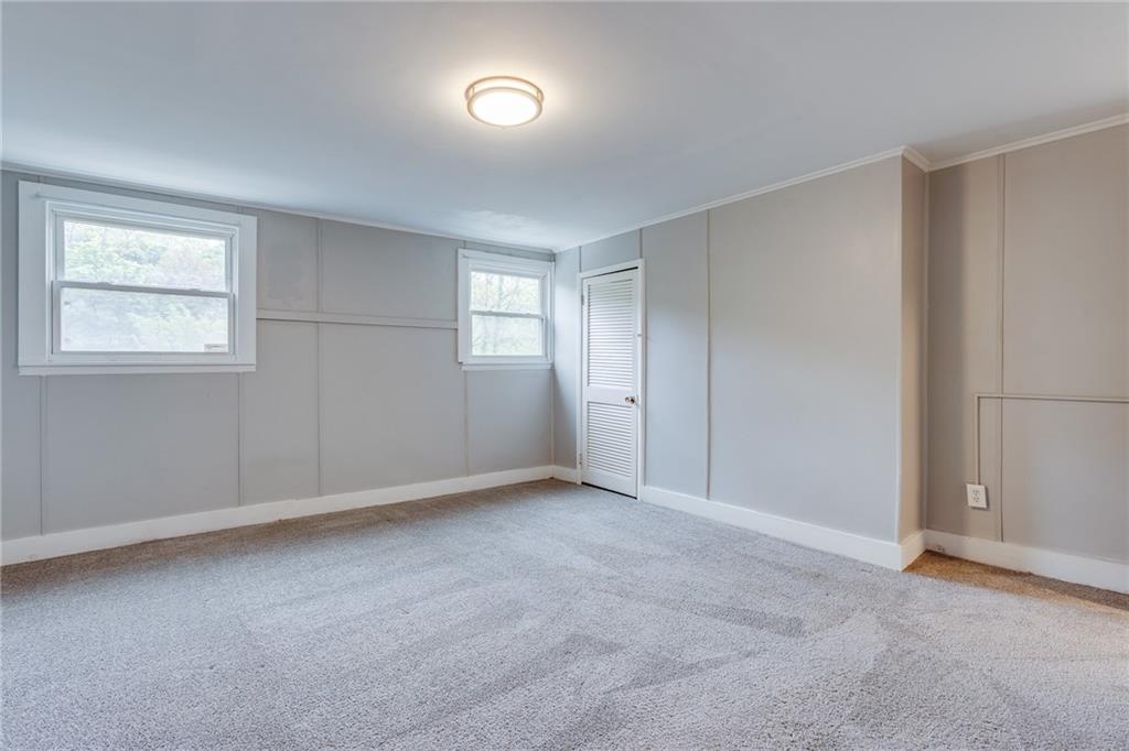 1931 Federal Street Extension Pittsburgh, PA 15212 - Photo 17 of 32 an empty room with windows and closet