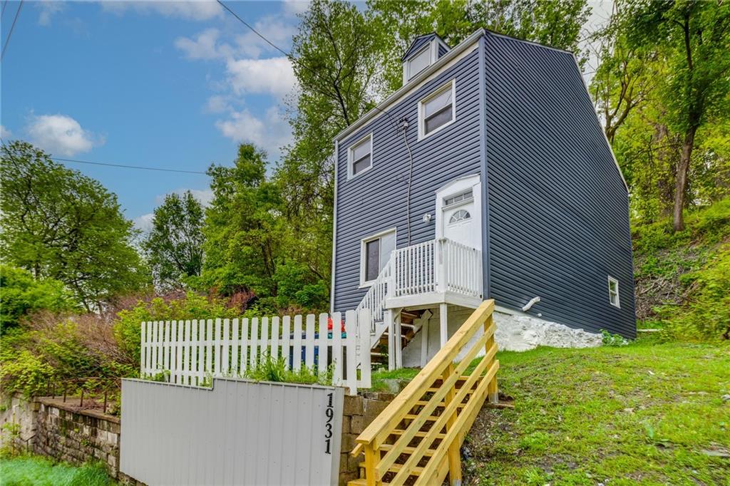 1931 Federal Street Extension Pittsburgh, PA 15212 - Photo 2 of 32 a view of a house with wooden fence