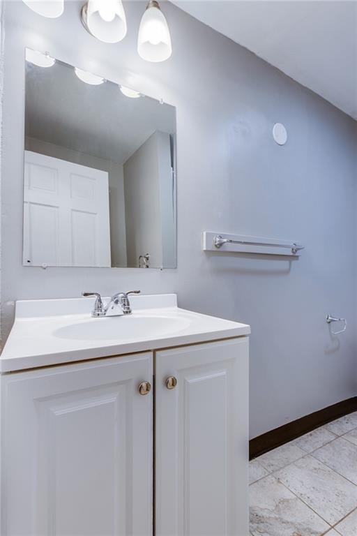 1931 Federal Street Extension Pittsburgh, PA 15212 - Photo 21 of 32 a bathroom with a sink and a mirror