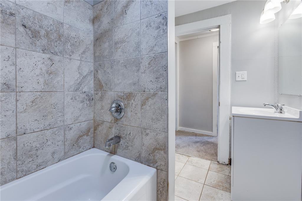 1931 Federal Street Extension Pittsburgh, PA 15212 - Photo 22 of 32 a bathroom with a bathtub and shower
