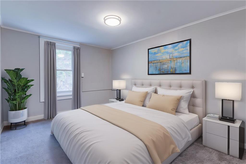 1931 Federal Street Extension Pittsburgh, PA 15212 - Photo 24 of 32 a bedroom with a bed and a potted plant