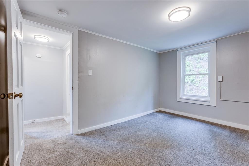 1931 Federal Street Extension Pittsburgh, PA 15212 - Photo 28 of 32 an empty room with windows and closet