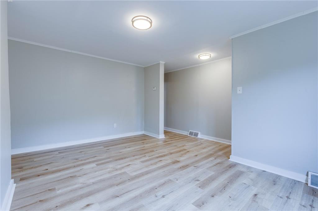 1931 Federal Street Extension Pittsburgh, PA 15212 - Photo 8 of 32 a view of an empty room with wooden floor