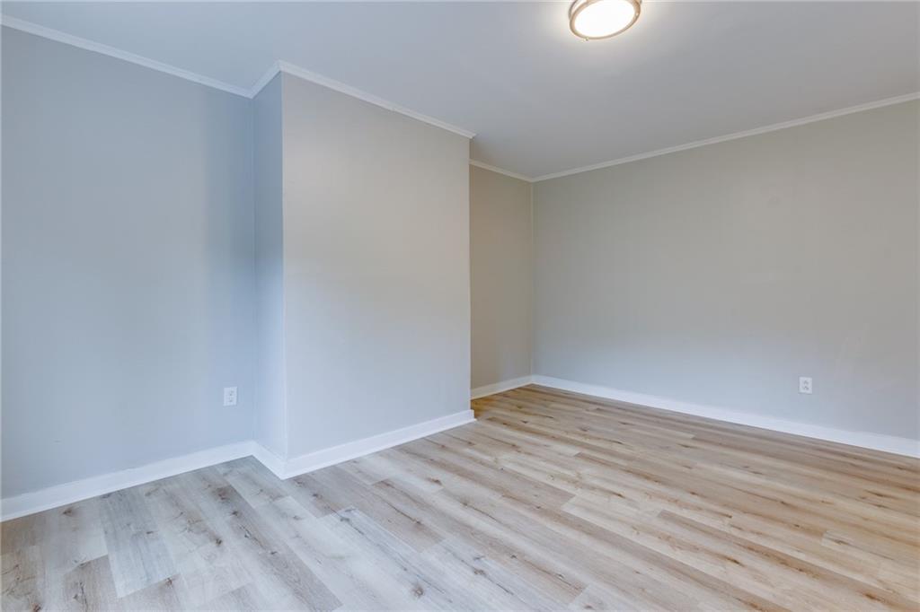 1931 Federal Street Extension Pittsburgh, PA 15212 - Photo 9 of 32 a view of an empty room with wooden floor
