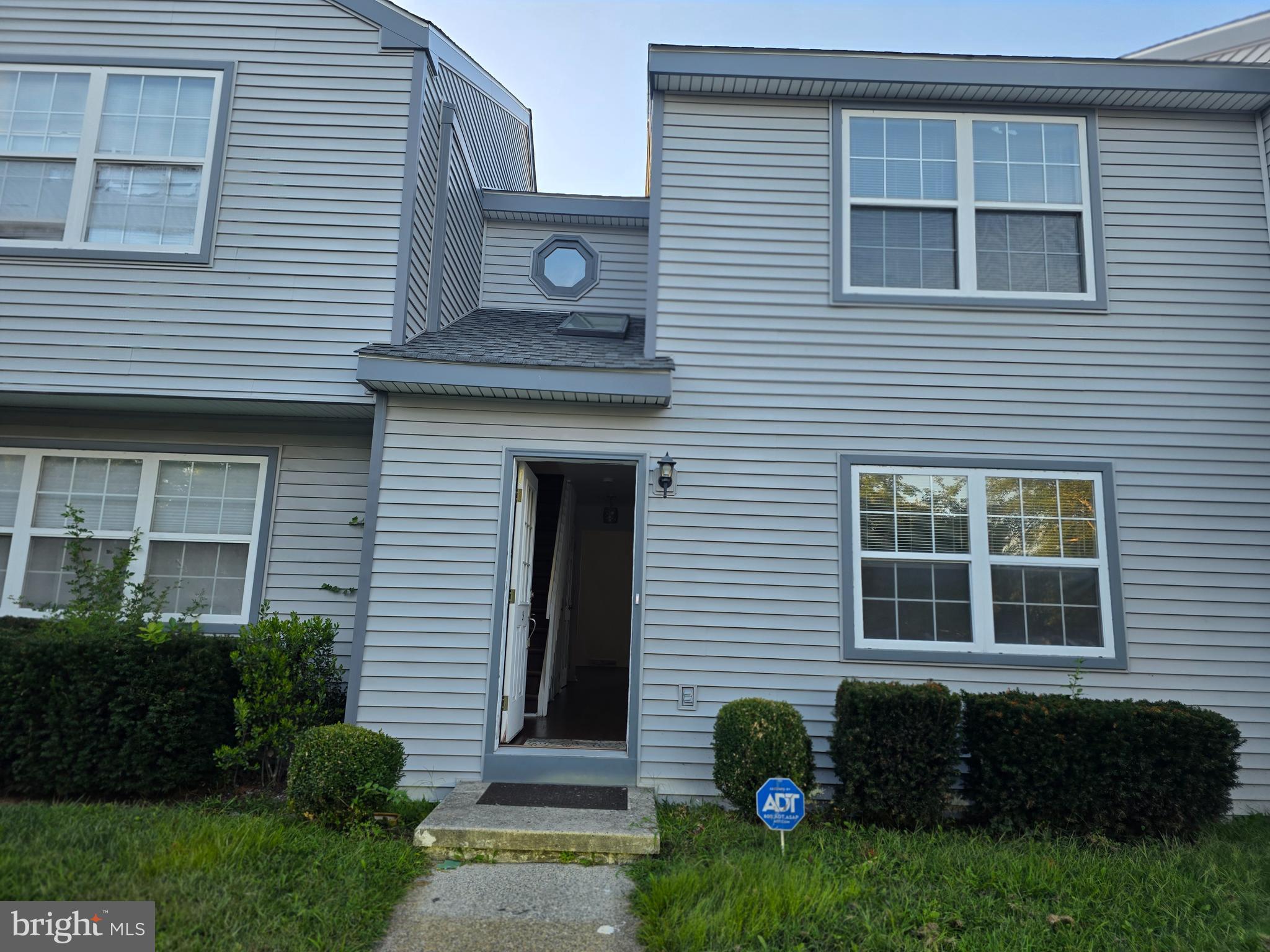 22 D Oyster Bay Absecon, NJ 08201 - Photo 1 of 13 a front view of a house with a garden