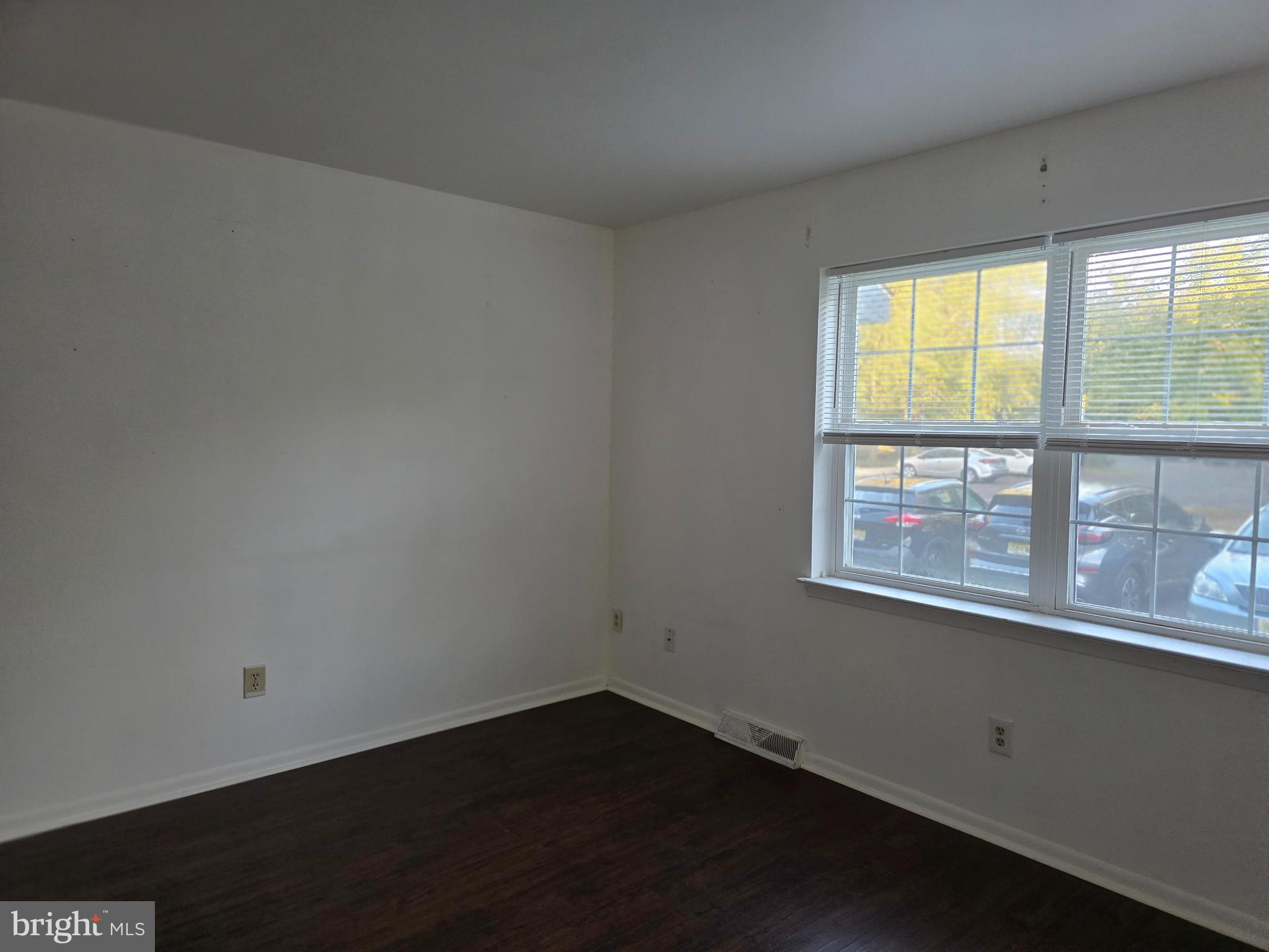 22 D Oyster Bay Absecon, NJ 08201 - Photo 2 of 13 an empty room with a window