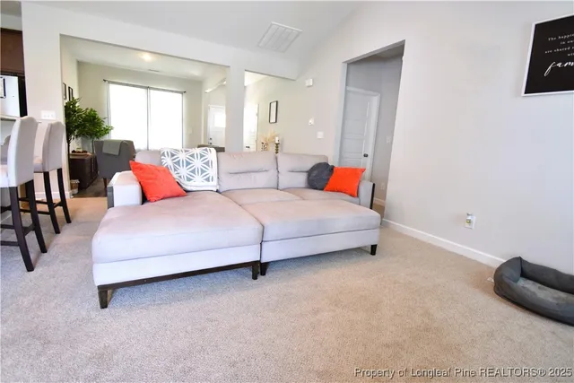 a bedroom with a bed and lamp