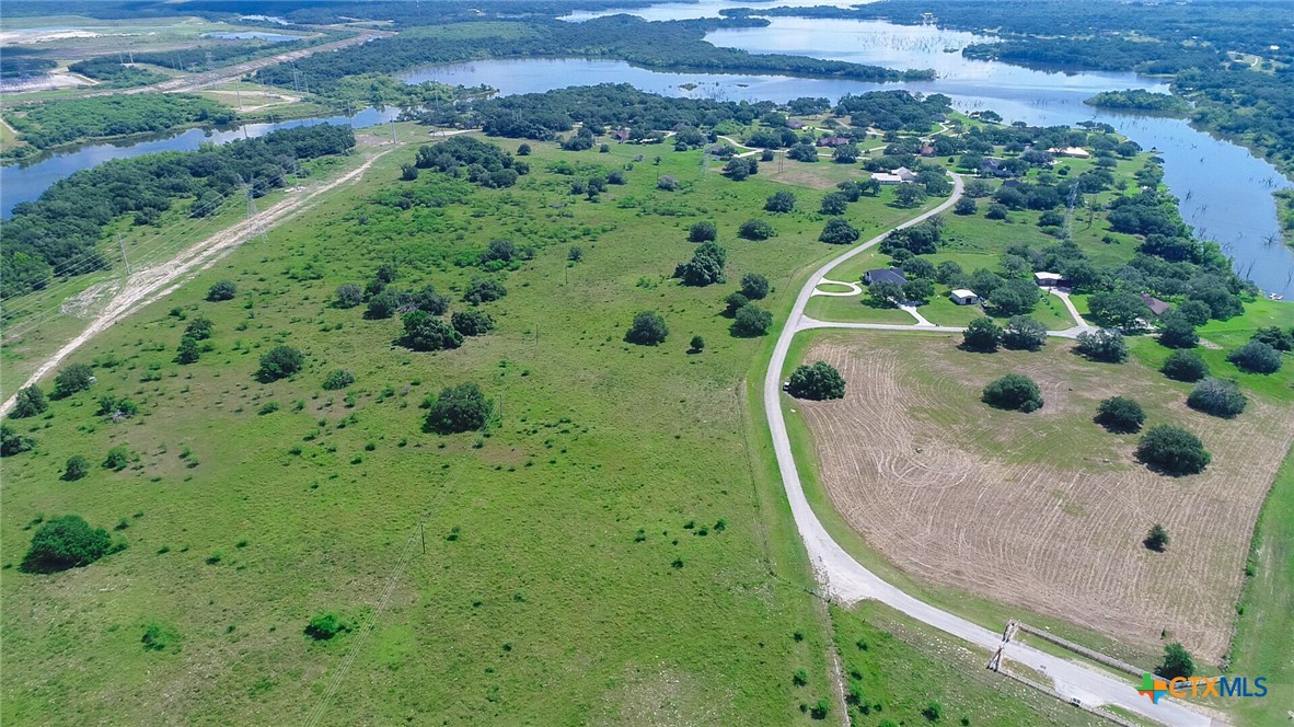 an aerial view of a residential houses with outdoor space