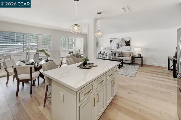 a very nice looking room with a large window and furniture