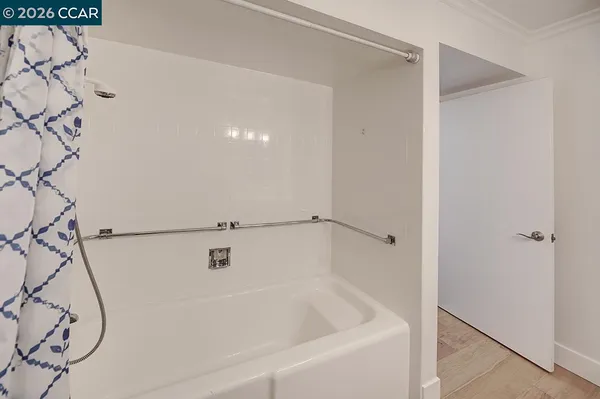 a bathroom with a shower and a window