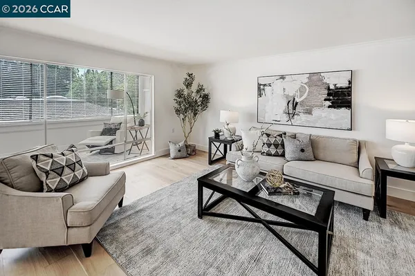 a living room with furniture and a large window