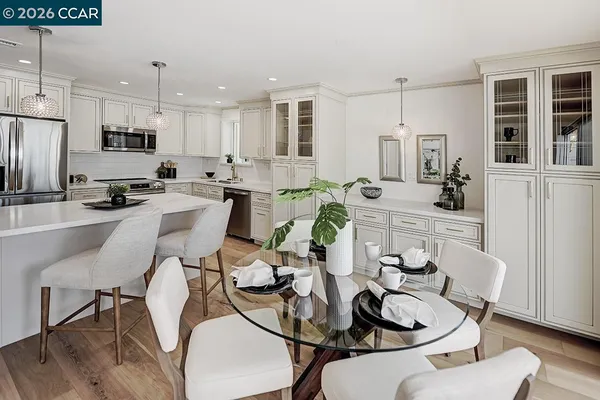 a view of a dining room with furniture and wooden floor