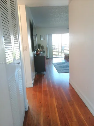 a view of entryway with wooden floor