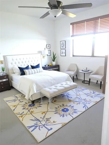 a bedroom with a bed and window