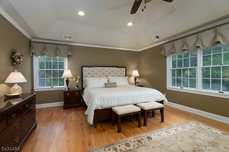 110 Orchard Road Skillman, NJ 08558 - Photo 23 of 43 a bedroom with a bed and wooden floor