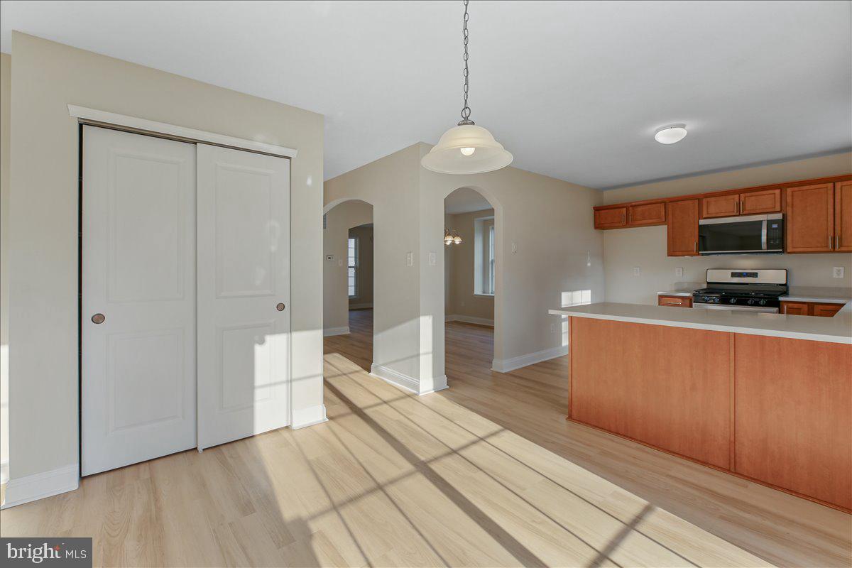 136 Kelly Driver Road Laurel Springs, NJ 08021 - Photo 15 of 35 a large kitchen with stainless steel appliances granite countertop a refrigerator and a stove top oven