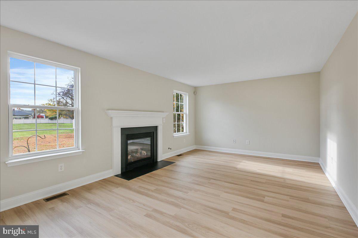 136 Kelly Driver Road Laurel Springs, NJ 08021 - Photo 16 of 35 wooden floor fireplace and windows in an empty room