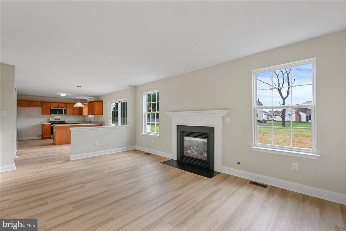 136 Kelly Driver Road Laurel Springs, NJ 08021 - Photo 17 of 35 a view of a livingroom with wooden floor and a fireplace