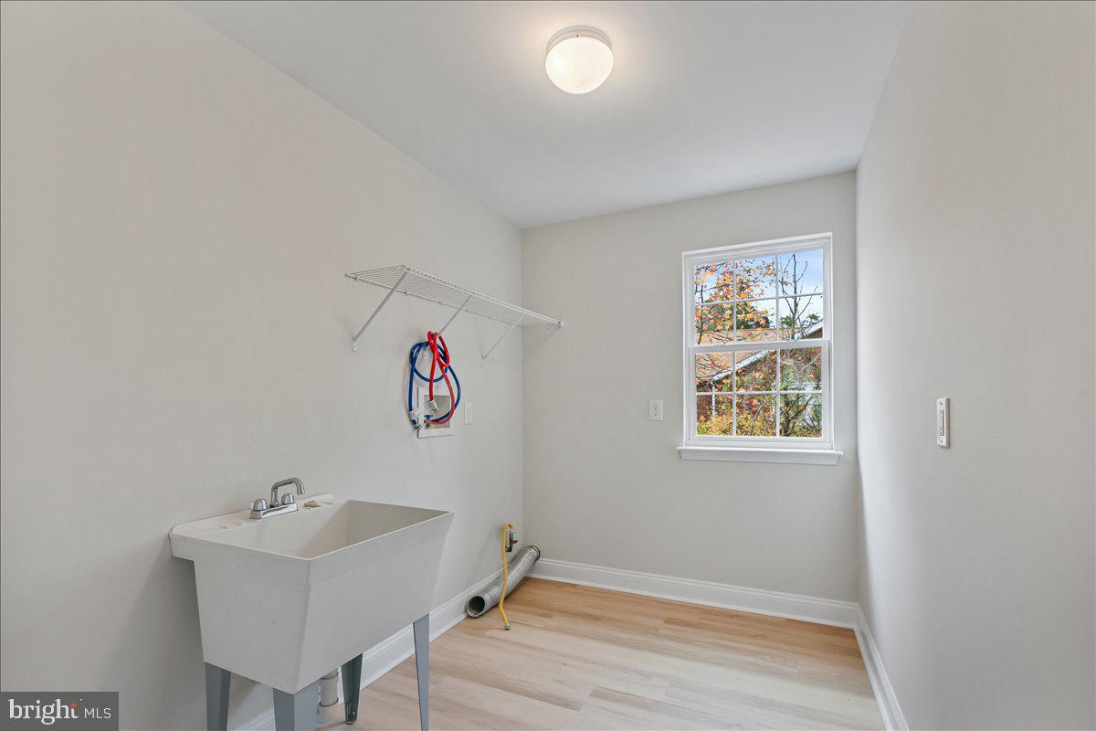 136 Kelly Driver Road Laurel Springs, NJ 08021 - Photo 18 of 35 a bathroom with a sink and a window