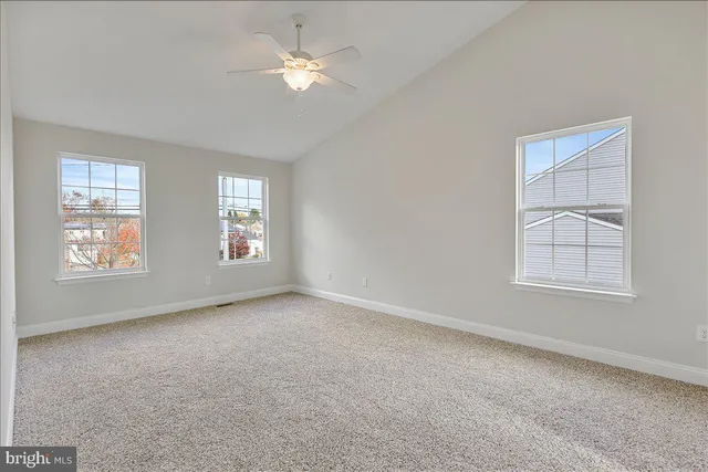 a view of empty room with windows
