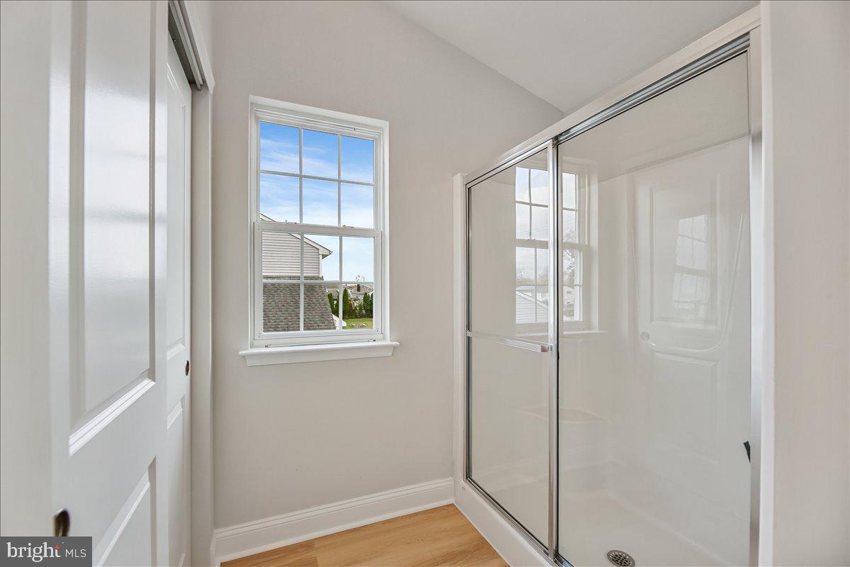 136 Kelly Driver Road Laurel Springs, NJ 08021 - Photo 25 of 35 a view of an empty room with wooden floor and a window