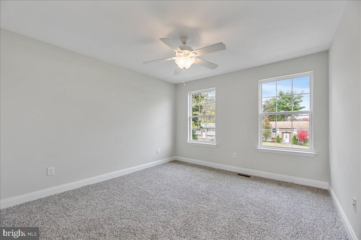 136 Kelly Driver Road Laurel Springs, NJ 08021 - Photo 26 of 35 an empty room with windows and fan