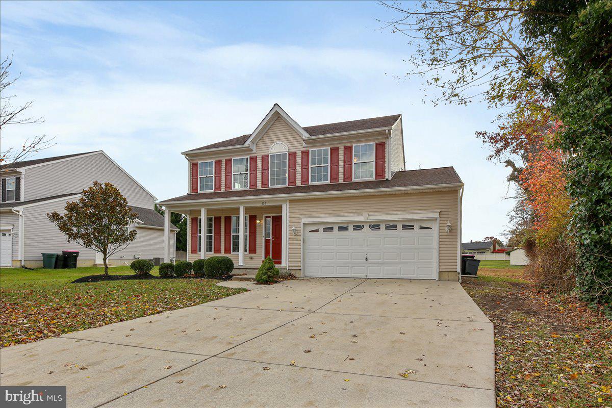 136 Kelly Driver Road Laurel Springs, NJ 08021 - Photo 3 of 35 a front view of a house with a yard and garage