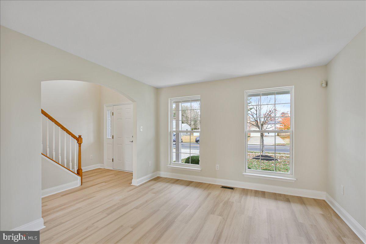 136 Kelly Driver Road Laurel Springs, NJ 08021 - Photo 6 of 35 a view of an empty room with wooden floor and a window