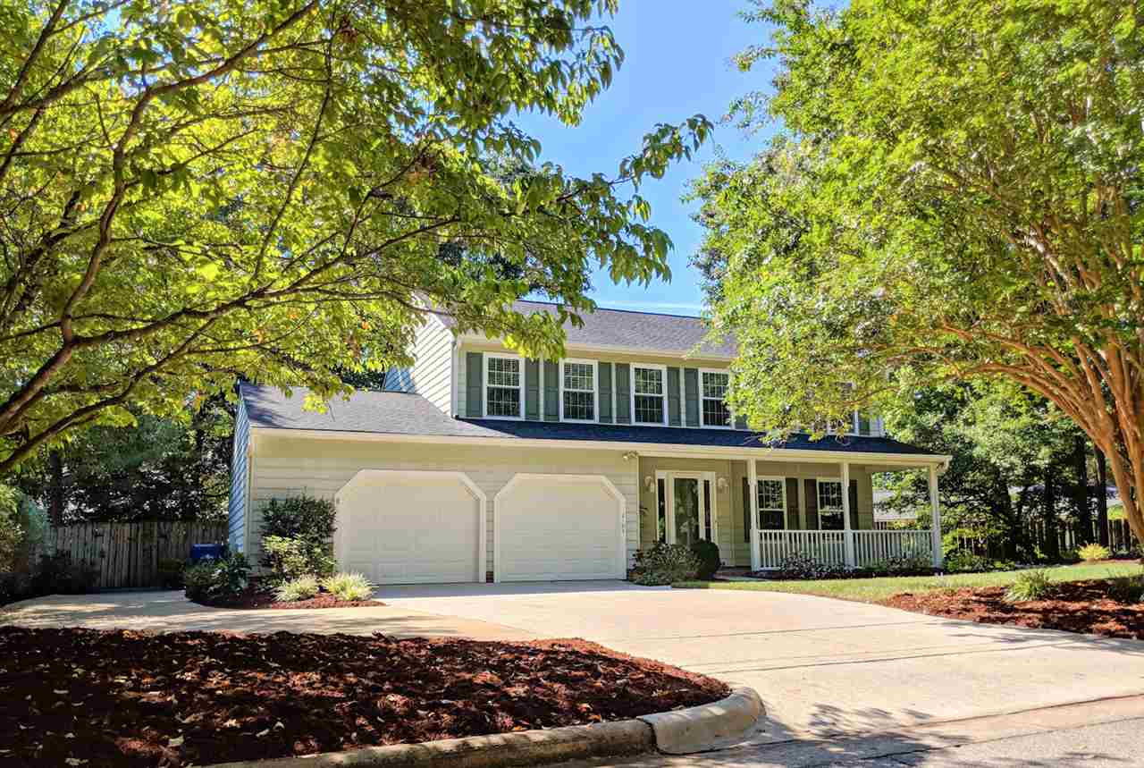 2104 Treverton Place Raleigh, NC 27609 - Photo 1 of 25 Loads of parking with extended parking pad, oversized garage and large front porch all found in this charming N. Raleigh home. Exterior Front