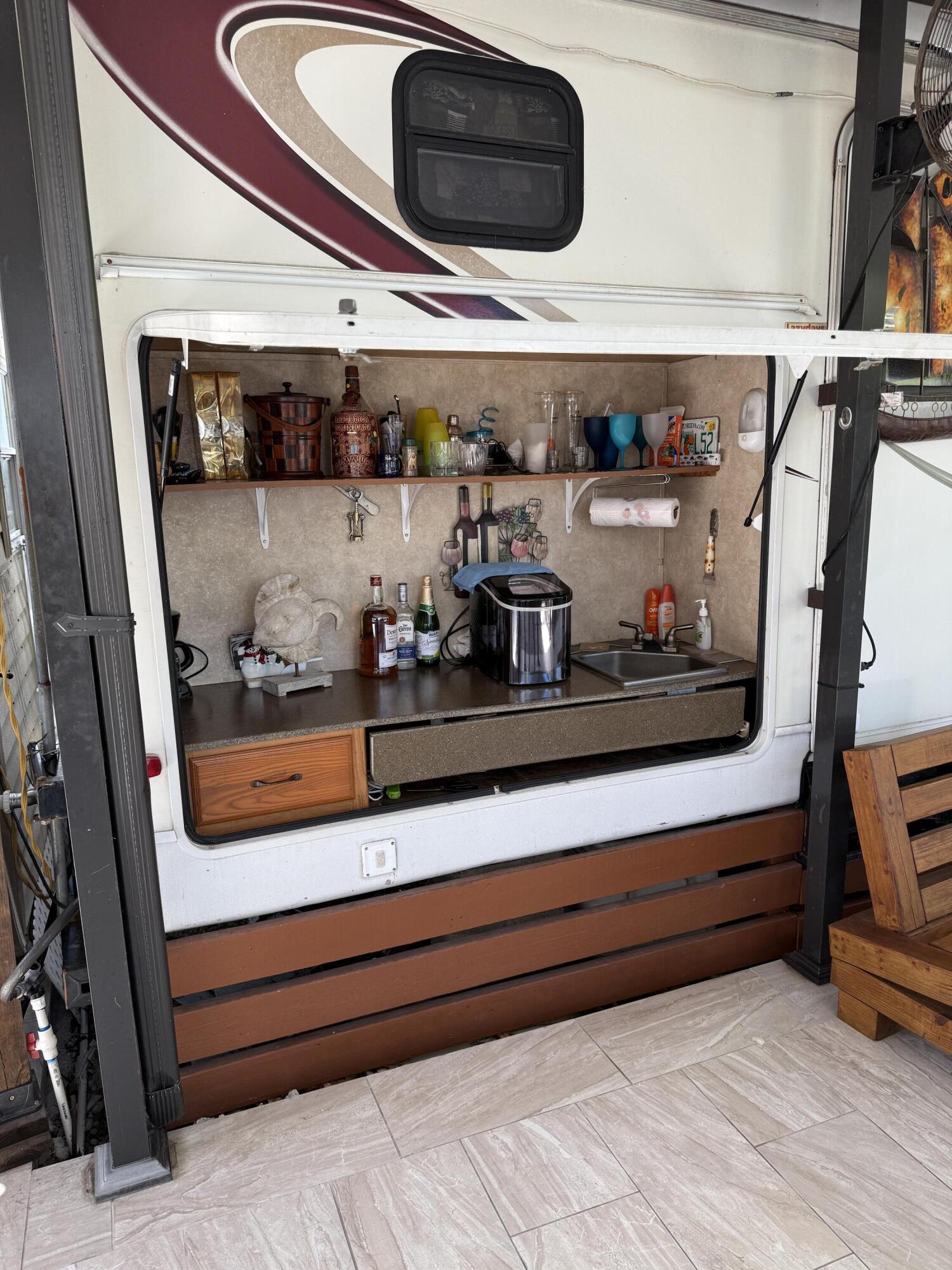 325 Calusa Street, Unit 393 Key Largo, FL 33037 - Photo 13 of 61 a view of walk in closet with clothes and shoes