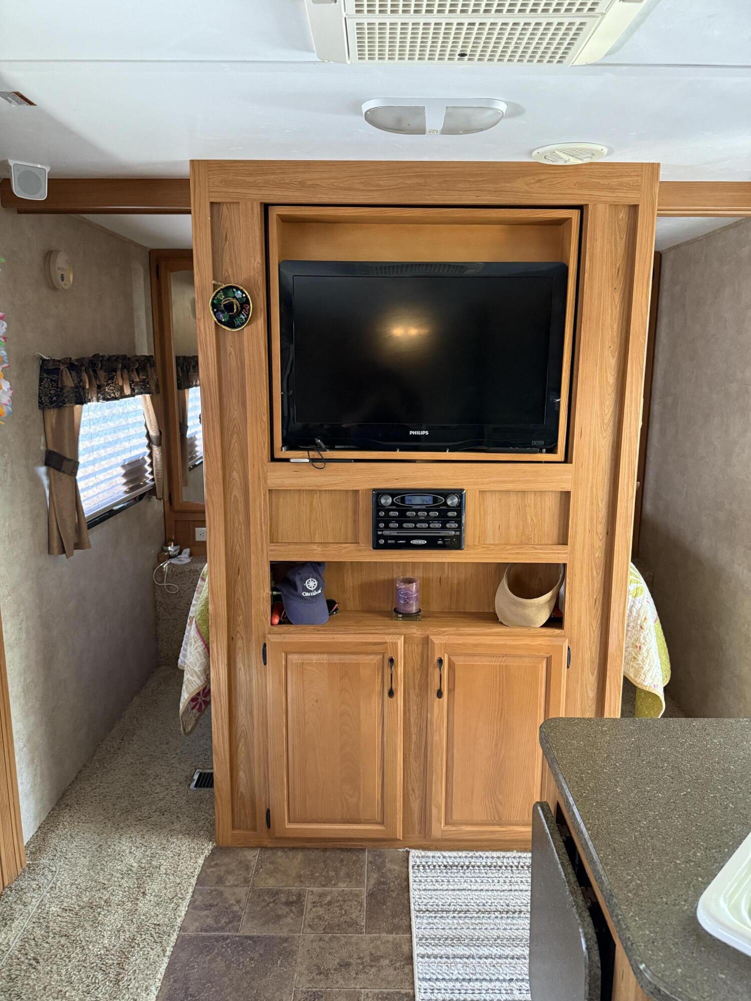 325 Calusa Street, Unit 393 Key Largo, FL 33037 - Photo 26 of 61 a living room with a flat screen tv and washer