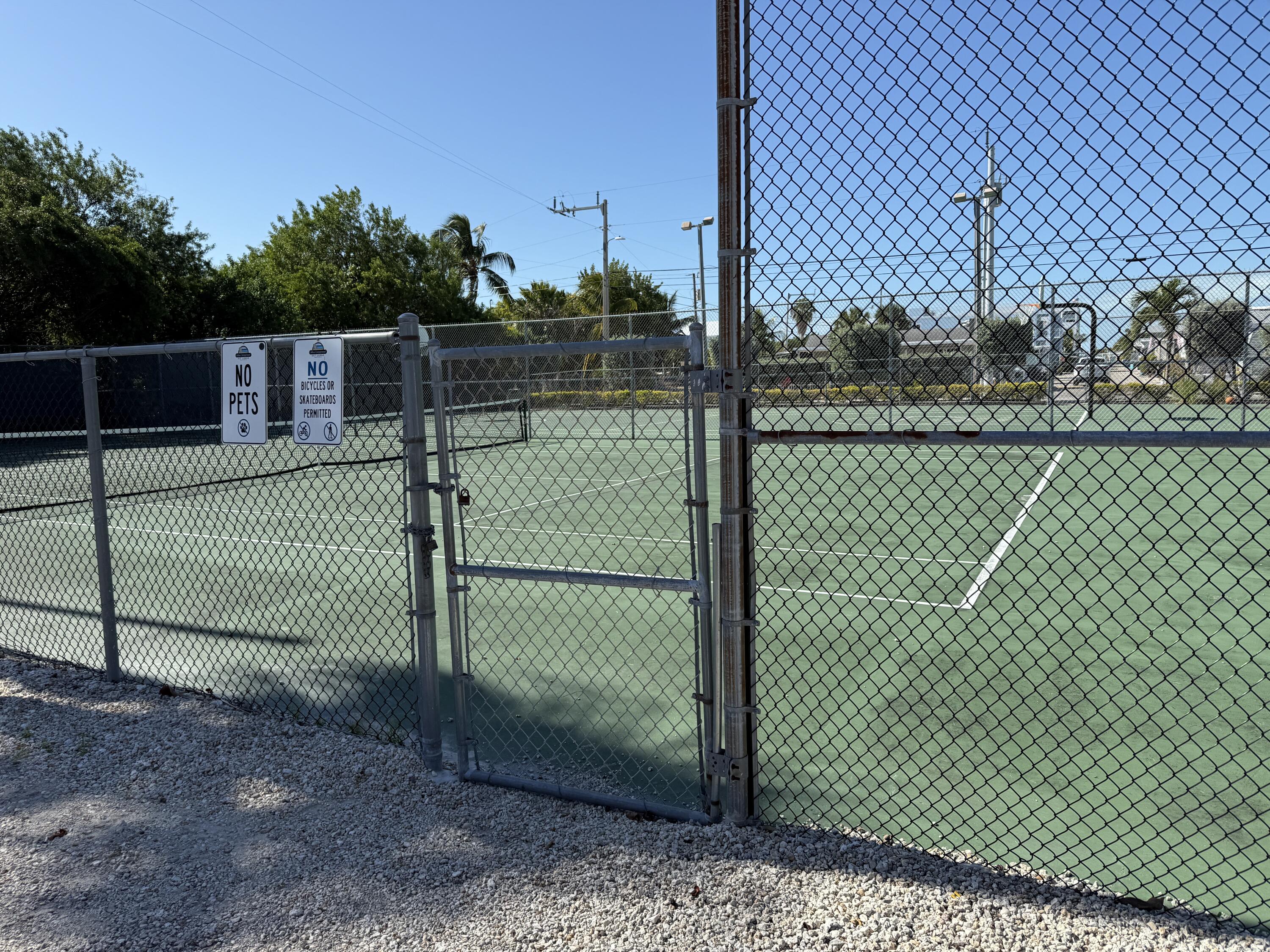 325 Calusa Street, Unit 393 Key Largo, FL 33037 - Photo 30 of 61 a view of a backyard and fence