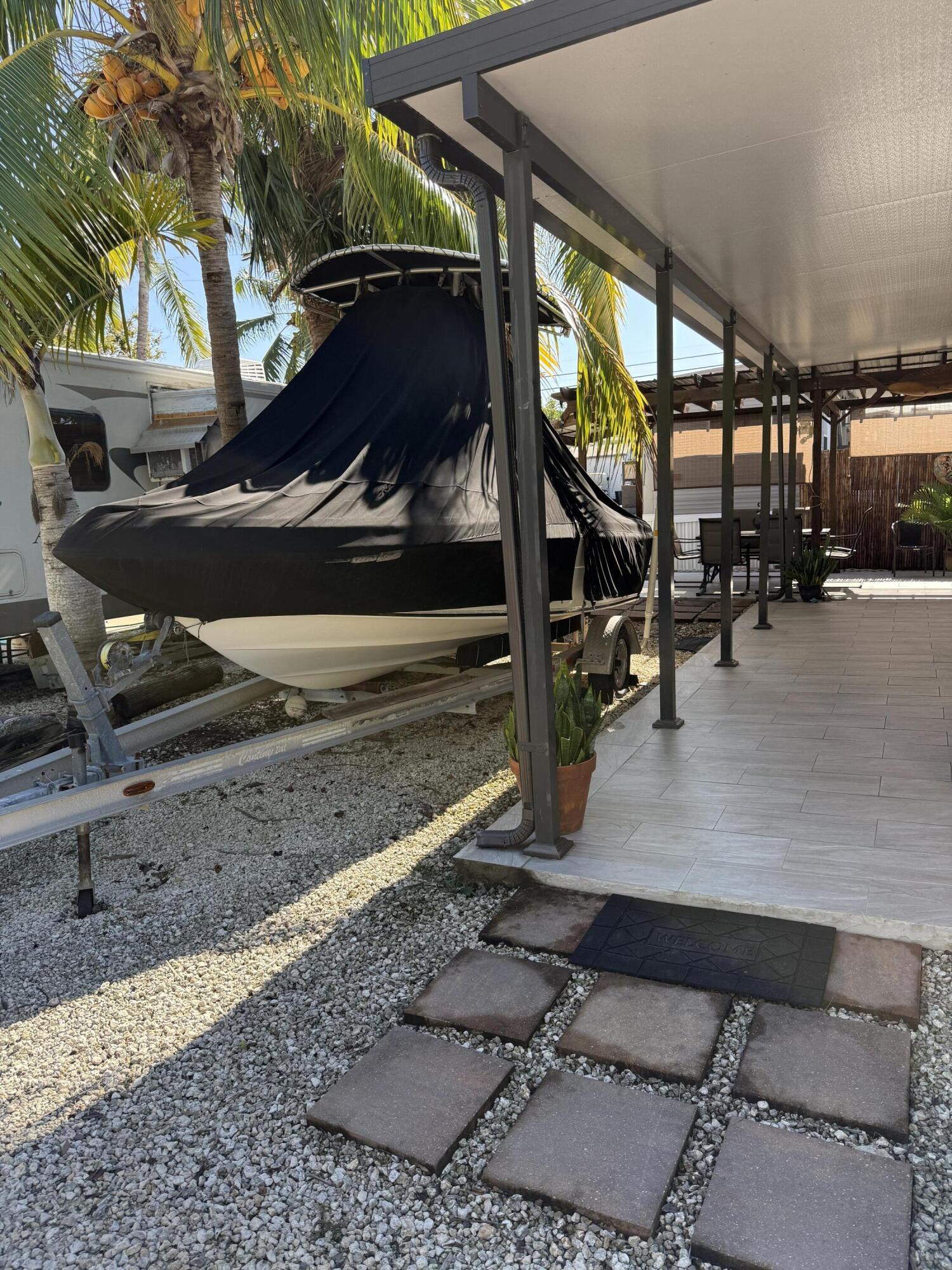 325 Calusa Street, Unit 393 Key Largo, FL 33037 - Photo 3 of 61 a view of a porch with a tv