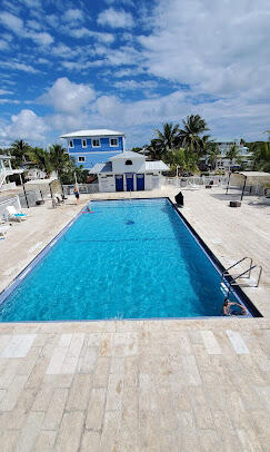 325 Calusa Street, Unit 393 Key Largo, FL 33037 - Photo 39 of 61 a view of swimming pool with outdoor seating