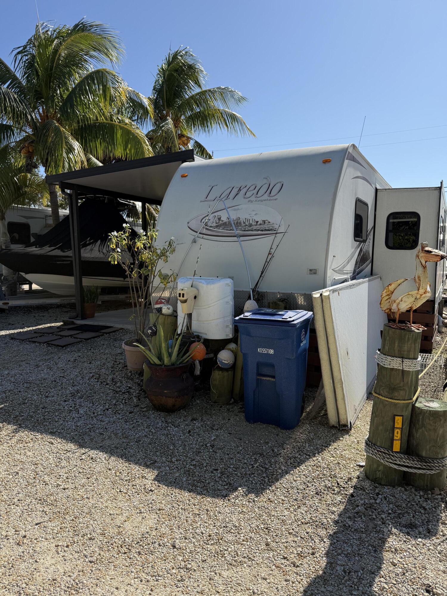 325 Calusa Street, Unit 393 Key Largo, FL 33037 - Photo 5 of 61 a view of a backyard