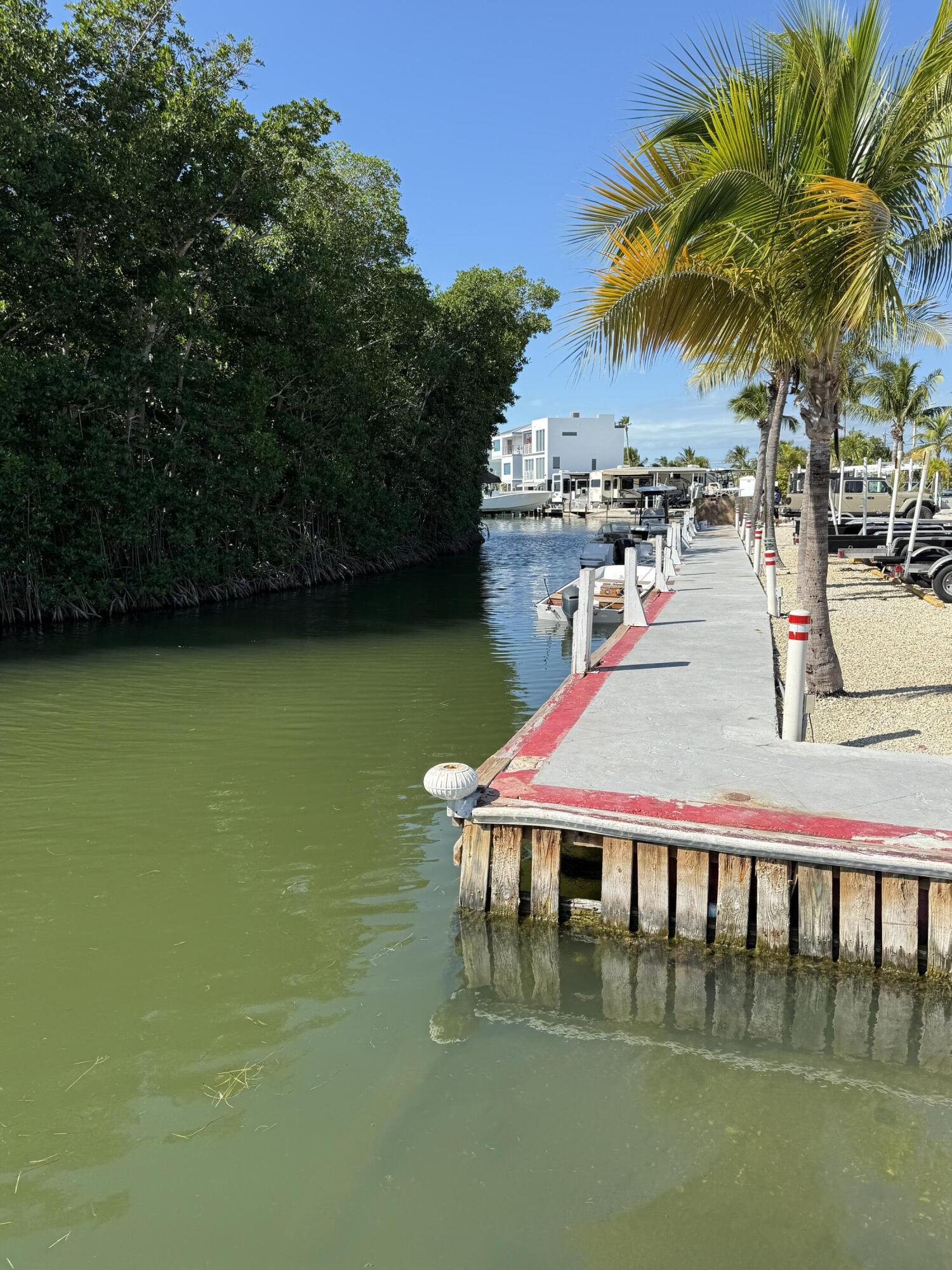 325 Calusa Street, Unit 393 Key Largo, FL 33037 - Photo 52 of 61 a view of swimming pool with outdoor seating