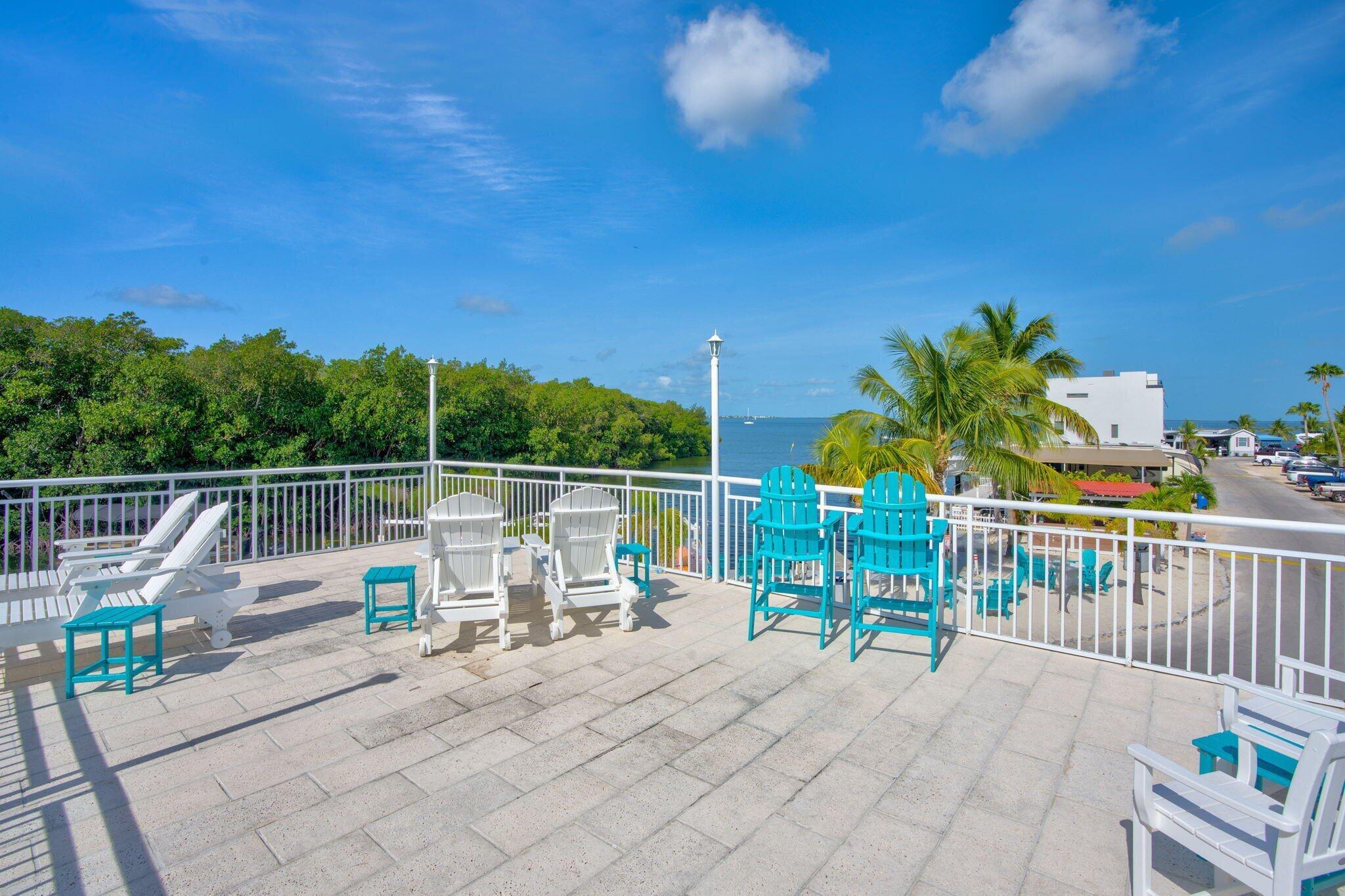 325 Calusa Street, Unit 393 Key Largo, FL 33037 - Photo 59 of 61 a view of two chairs and table in the terrace