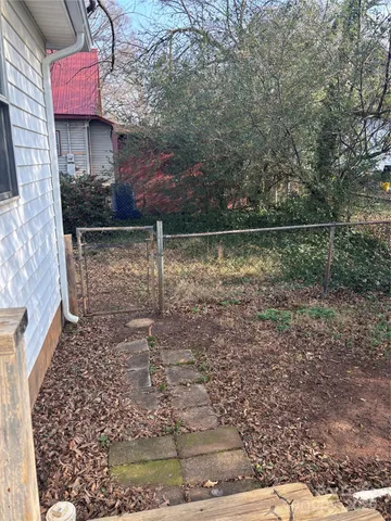 a view of a park with large trees