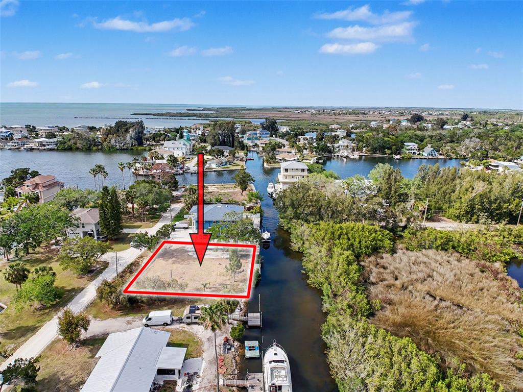 8 Rice Road Hudson, FL 34667 - Photo 18 of 30 an aerial view of a houses with a lake view