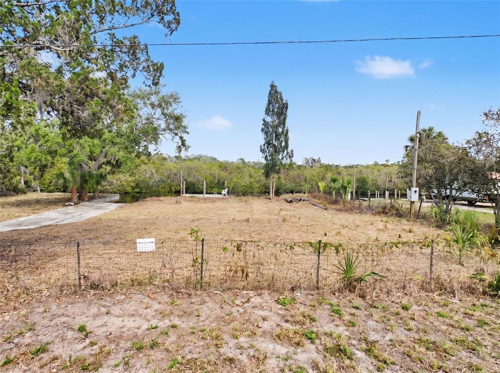 8 Rice Road Hudson, FL 34667 - Photo 2 of 30 a view of a yard with an outdoor space
