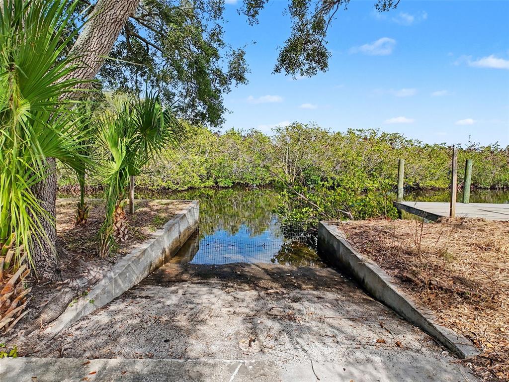 8 Rice Road Hudson, FL 34667 - Photo 3 of 30 a view of a yard with wooden fence