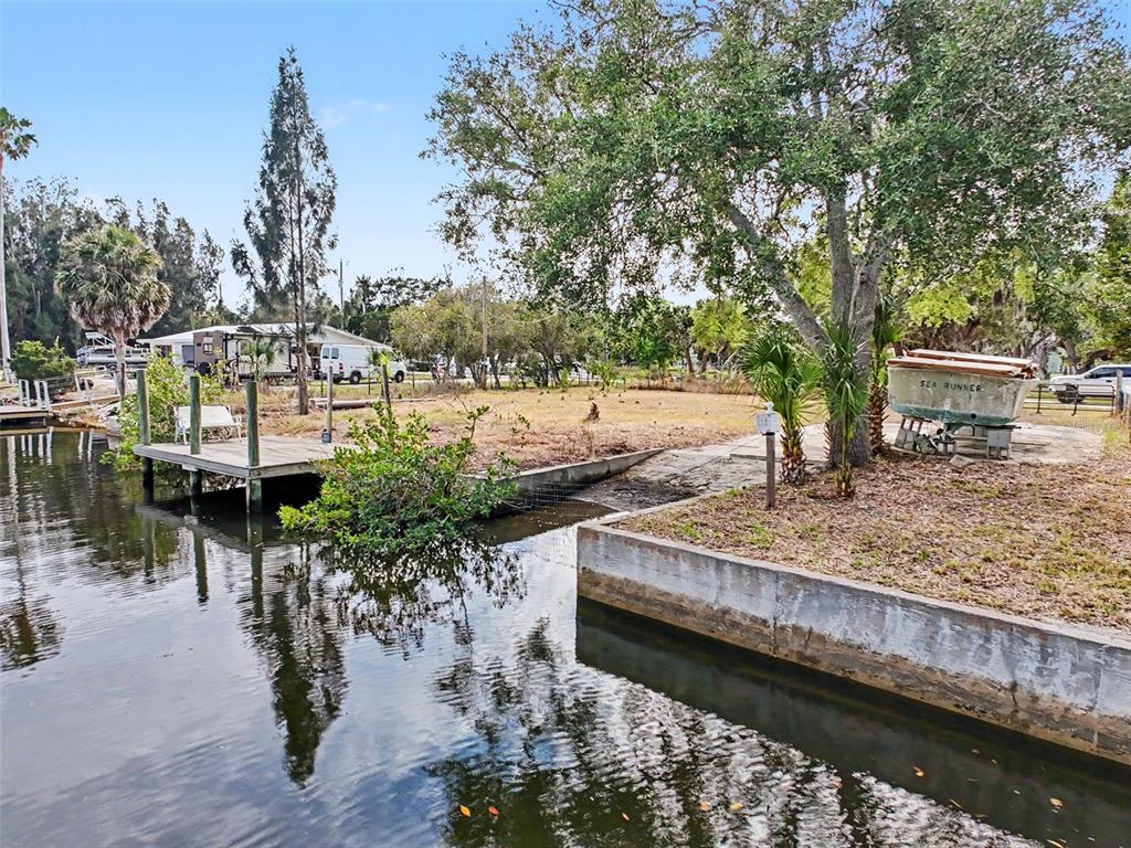 8 Rice Road Hudson, FL 34667 - Photo 7 of 30 a view of a lake with a house