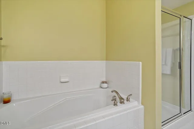 a en suite bathroom with a sink and a mirror